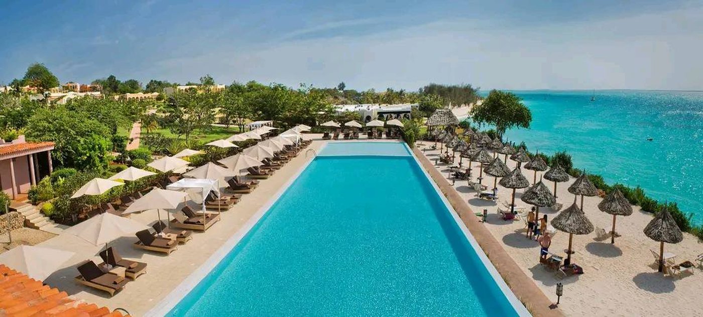 Pool and beach loungers at sunset