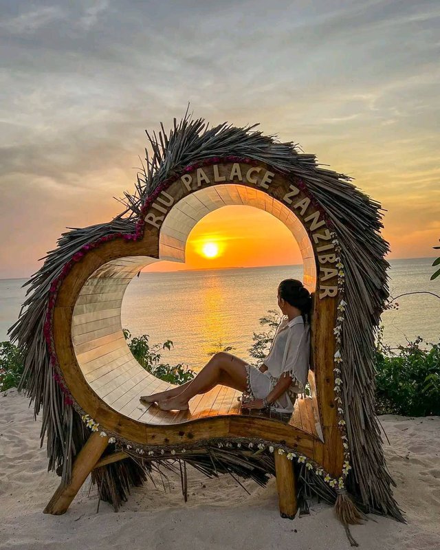 Sunset at the Riu Palace Zanzibar beach sign