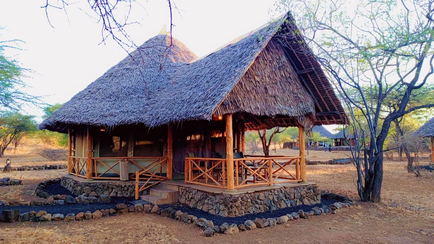Thatched safari tent (banda) on its stone platform