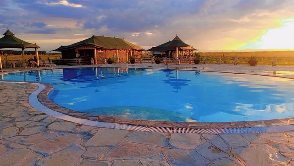 Swimming pool at sunset, Maisha Sweetwaters